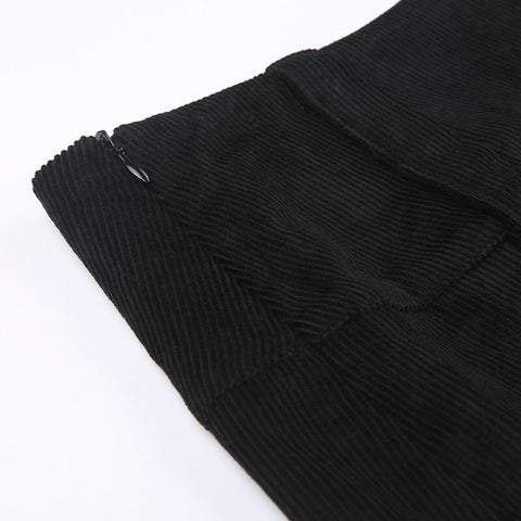Minifalda plisada de talle alto de pana negra